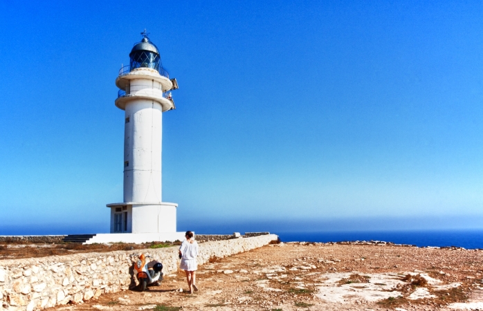 A woman setting her sights on the Formentera Lighthouse.
