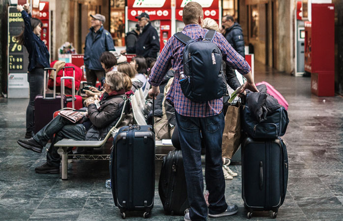 Read the fine print when it comes to how much your checked and carry-on bags can weigh