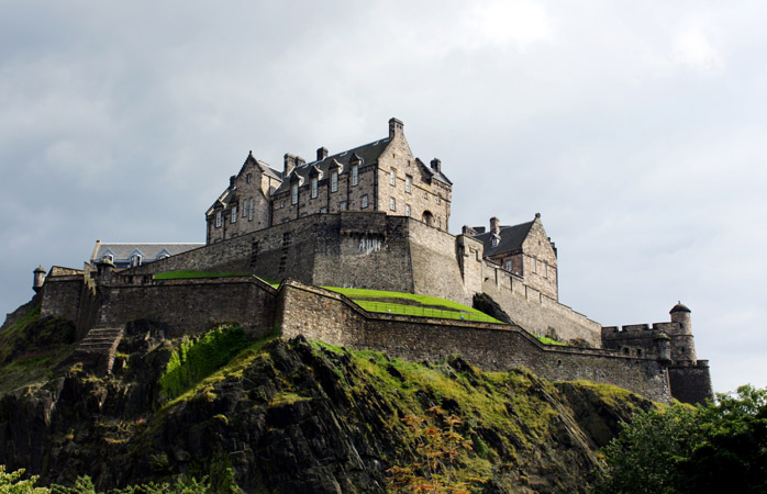 Edinburgh's iconic castle looms over the city on a gloomy day 