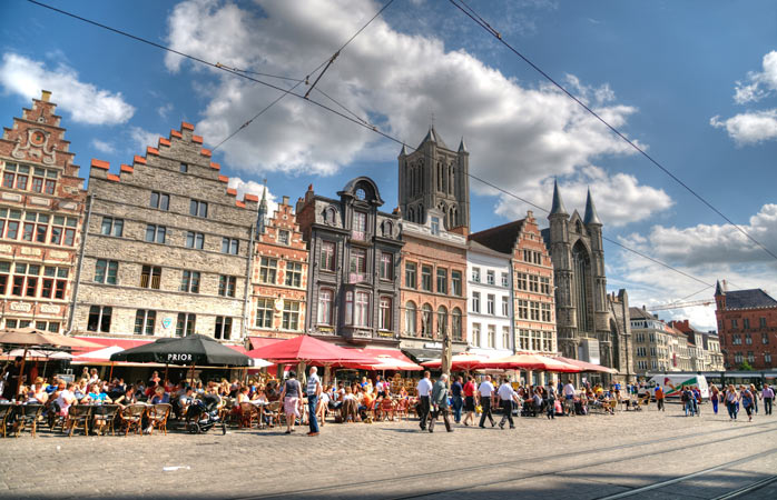 Tourists walk around Ghent's charming city centre