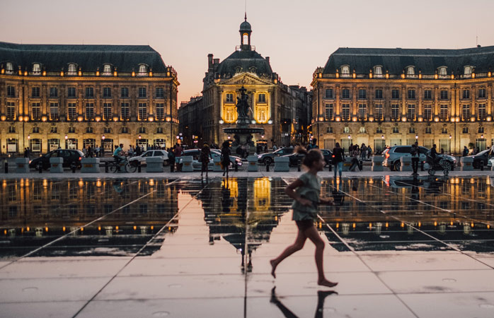 Bordeaux's beautiful Place de la Bourse reflects in the Water Mirror