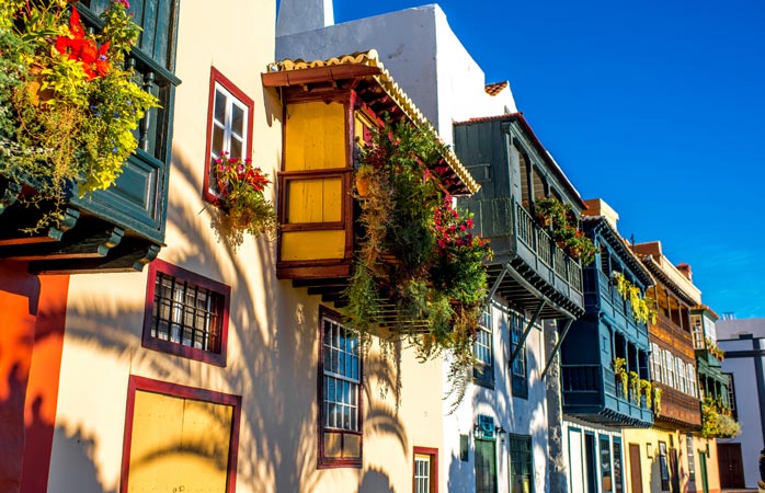 Snap a colourful picture of the famous flower-bedecked balconies 