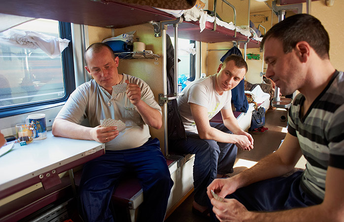 Local passengers playing cards on the train