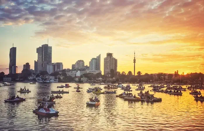 Rental pedalo boats in Vienna, Austria during sunset in summer