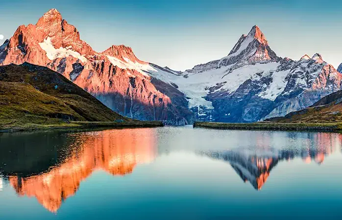 Fantastic evening panorama of Bachalp lake / Bachalpsee, Switzerland. Picturesque autumn sunset in Swiss alps, Grindelwald, Bernese Oberland, Europe. Beauty of nature concept background.
; Shutterstock ID 1216555750; Purpose: Eco friendly destinations; Brand (KAYAK, Momondo, Any): momondo