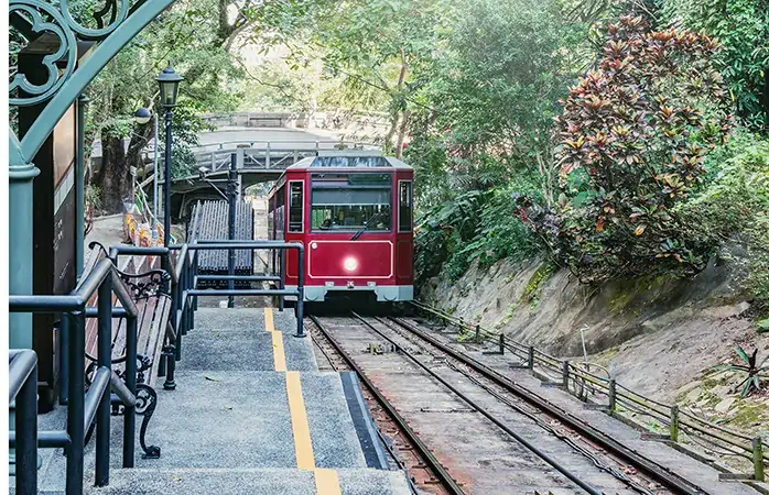 Retro tram moves to Victoria Peak. Hong Kong..; Shutterstock ID 1263139645; Purpose: Eco friendly destinations; Brand (KAYAK, Momondo, Any): momondo