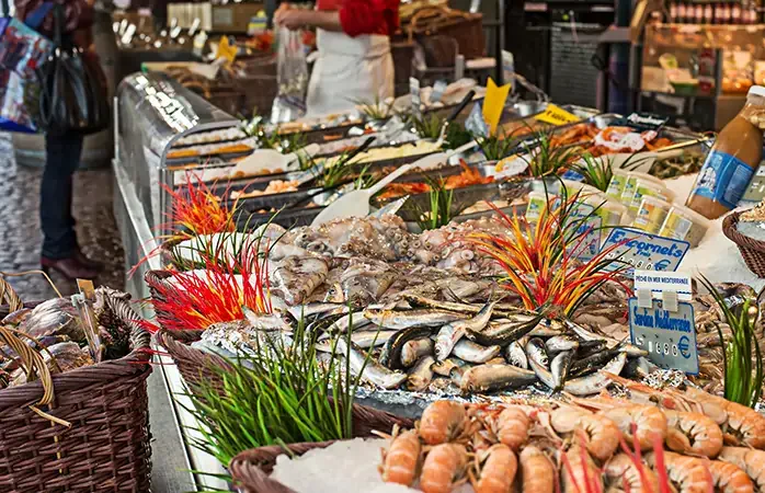 Fish for sale at open market at Rue Mouffetard in Paris, France.; Shutterstock ID 306493784; Purpose: Eco friendly destinations; Brand (KAYAK, Momondo, Any): momondo