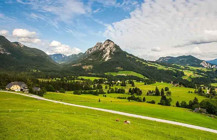 Large view at the high mountains Alps Austria; Shutterstock ID 215839702; Purpose: Eco friendly destinations; Brand (KAYAK, Momondo, Any): momondo